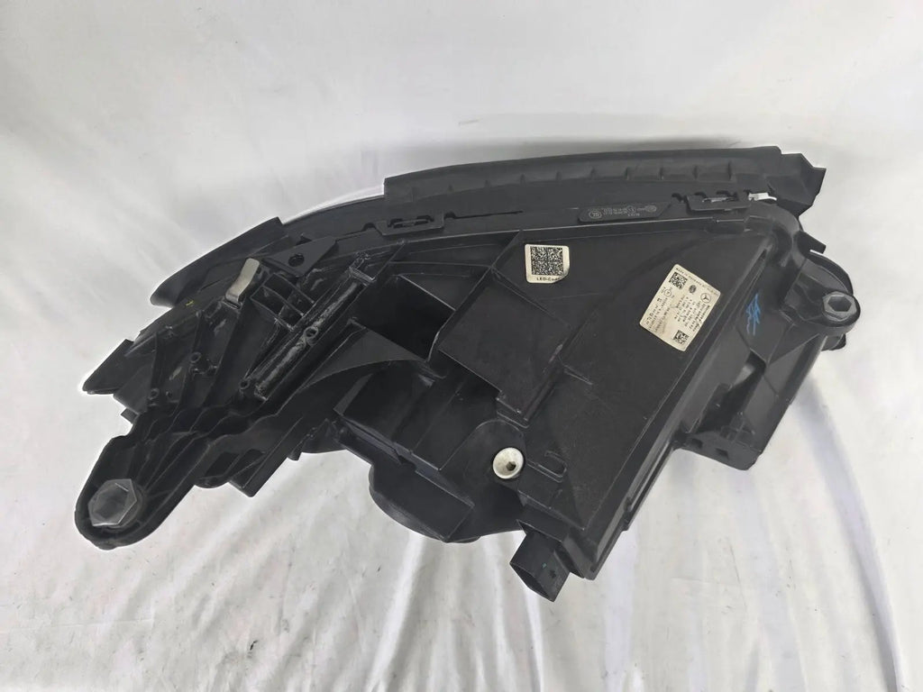 This image displays the left-side Multibeam LED headlight with blue accents for the Mercedes-Benz E-Class W213, featuring OEM genuine quality and part number A2139066504. This original used headlamp is designed for precise fitment on the W213 model, offering advanced Multibeam LED technology with distinctive blue detailing for high-performance adaptive illumination and premium styling