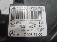 Load image into Gallery viewer, This image shows the left-side Xenon headlight for the Mercedes-Benz CLA Class C117, featuring original OEM quality with part number A1179065100. The headlight is a used but genuine component, designed to perfectly fit the left side of the CLA C117 model. It includes the factory-built Xenon lighting system and showcases the durable construction expected from Mercedes-Benz parts.