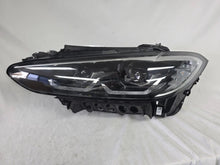 Load image into Gallery viewer, Used genuine BMW LED headlight for 4 Series models including G22, G23, G26, G80, G82, and G83. This left-side OEM headlamp, part number 9851035, is designed to perfectly fit and function in compatible BMW vehicles. The image shows the original BMW LED headlight in used condition with visible connectors, housing, and lens – ideal for replacement or repair of your vehicle’s front lighting system.