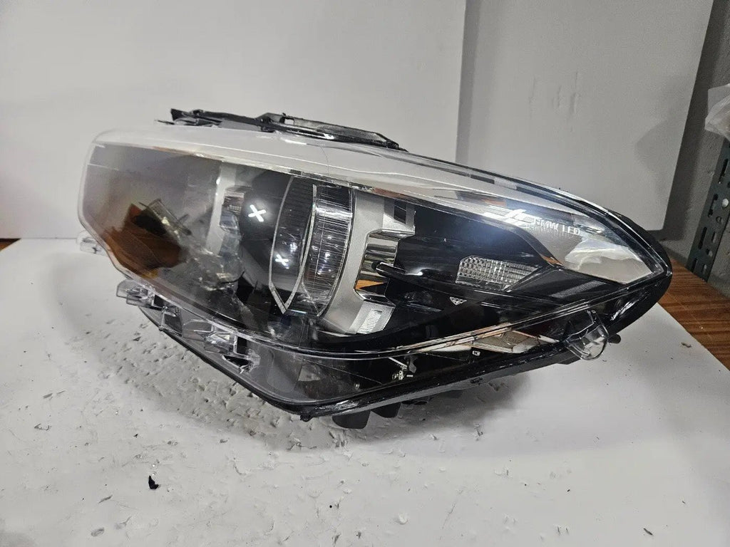 This image features the left-side LED headlight for the BMW 1 Series F20 and F21 LCI (facelift) models, with OEM genuine quality and part number 7492621. This used original headlamp is designed specifically for the facelifted versions, offering sharp LED illumination, precise fitment, and the premium build quality expected from BMW OEM components