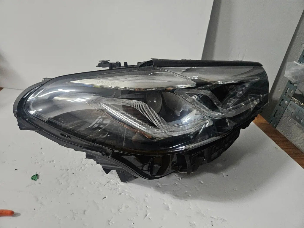 This image displays the right-side Adaptive LED headlight for BMW 5 Series G30, G31, and F90 LCI (facelift) models, featuring OEM genuine quality with part number 9850582. This used original headlamp is engineered for precise fitment and enhanced visibility, offering BMW’s Adaptive LED technology with dynamic lighting performance and premium styling for the facelifted 5 Series.