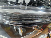 Load image into Gallery viewer, This image shows the left-side Xenon headlight for the Mercedes-Benz CLA Class C117, featuring original OEM quality with part number A1179065100. The headlight is a used but genuine component, designed to perfectly fit the left side of the CLA C117 model. It includes the factory-built Xenon lighting system and showcases the durable construction expected from Mercedes-Benz parts.