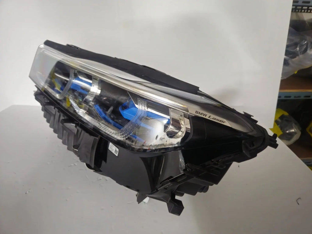 This image features the left-side Laser headlight for the BMW 7 Series G11 LCI and G12 LCI models, with OEM genuine quality and part number 9450229. Specifically designed for the facelifted (LCI) versions of the G11 and G12, this used original headlamp offers cutting-edge BMW Laserlight technology, precision fitment, and exceptional nighttime visibility, perfectly aligning with the luxury and performance of the 7 Series