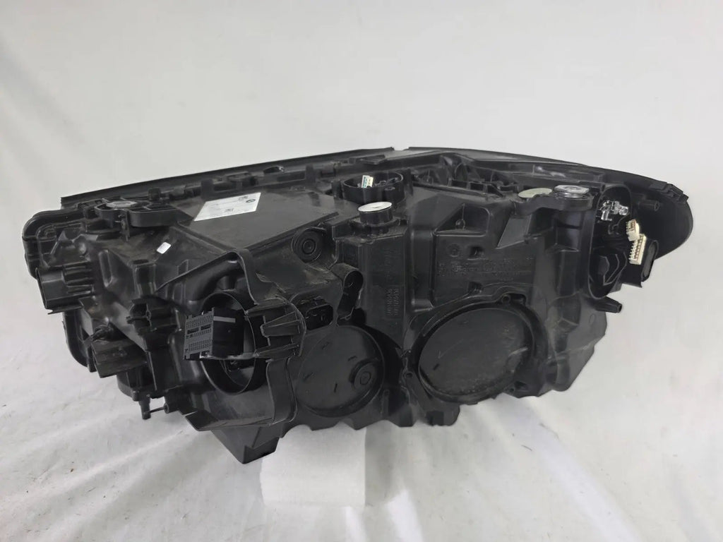 Genuine OEM Adaptive LED headlight for BMW iX3 and compatible models including G08, G01, F97, G02, and F98 with LCI (facelift) updates. This right-side headlamp, part number 5A29204, features adaptive lighting technology for enhanced road illumination and driving safety. The image showcases the original right LED headlight in used condition, clearly showing the lens, housing, and connector points — perfect for replacement on BMW iX3 and related LCI models.