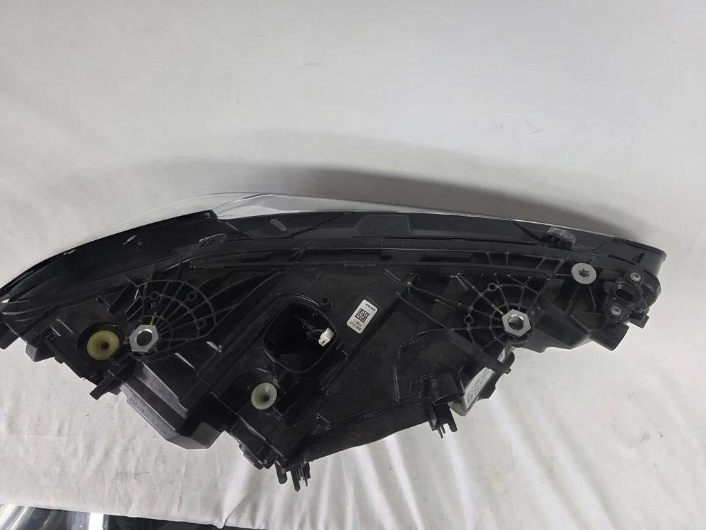 Used genuine BMW LED headlight for 4 Series models including G22, G23, G26, G80, G82, and G83. This left-side OEM headlamp, part number 9851035, is designed to perfectly fit and function in compatible BMW vehicles. The image shows the original BMW LED headlight in used condition with visible connectors, housing, and lens – ideal for replacement or repair of your vehicle’s front lighting system.