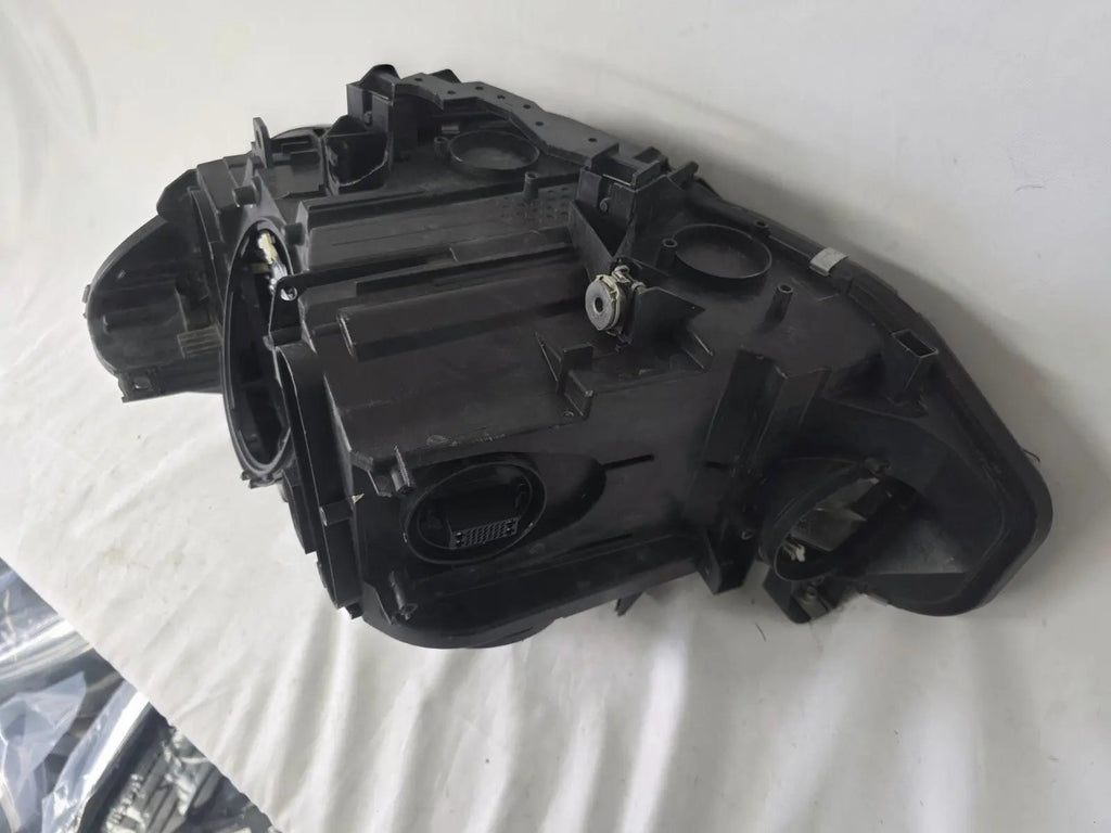 Genuine used BMW Adaptive LED headlight for 4 Series models F32, F33, F36, F80 LCI, F82, and F83. This right-side OEM headlamp, part number 7377842, is designed with adaptive lighting technology for improved visibility and performance. The image highlights the complete original headlight unit in used condition, including the clear lens, mounting points, and electrical connectors — ideal for replacement on compatible BMW models.