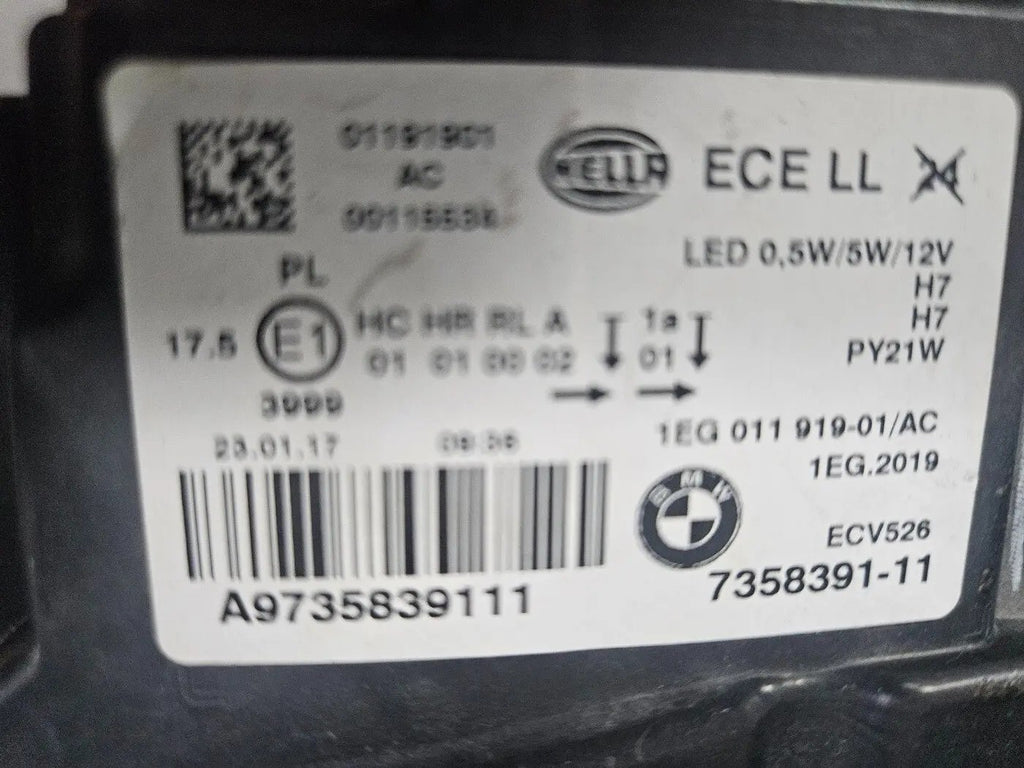 This image displays the left-side LED headlight for the BMW 1 Series F20 and F21 models, featuring OEM genuine quality with part number 7358391. This used original headlamp offers bright LED illumination, precise factory fitment, and durable performance, perfectly suited for the sporty and compact design of the BMW 1 Series