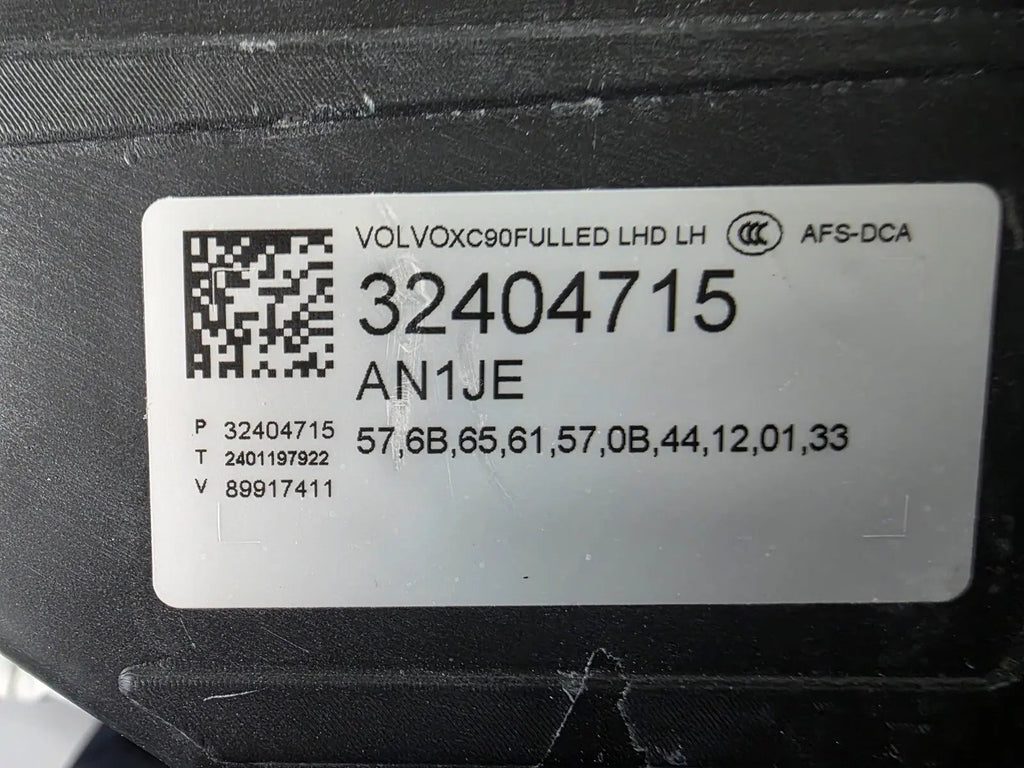 This image features the left-side Xenon headlight for the Volvo XC90, showcasing OEM genuine quality with part number 32404715. This used original headlamp is designed for accurate fitment and delivers powerful Xenon illumination, ensuring optimal visibility, durability, and premium performance for the XC90 luxury SUV