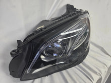 Load image into Gallery viewer, This image displays the left-side Multibeam LED headlight with blue accents for the Mercedes-Benz E-Class W213, featuring OEM genuine quality and part number A2139066504. This original used headlamp is designed for precise fitment on the W213 model, offering advanced Multibeam LED technology with distinctive blue detailing for high-performance adaptive illumination and premium styling