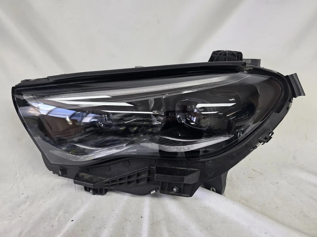 This image shows the left-side DIGITAL LIGHT headlight for the Mercedes-Benz E-Class W214, featuring OEM genuine quality with part number A2149066102. Designed for a precise fit on the left side of the W214 model, this used original headlamp offers Mercedes-Benz’s advanced DIGITAL LIGHT technology for superior adaptive illumination and driving safety.
