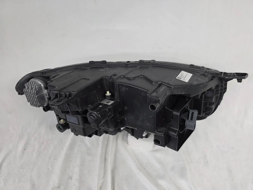 This image features the left-side Xenon headlight for the Volvo XC90, showcasing OEM genuine quality with part number 32404715. This used original headlamp is designed for accurate fitment and delivers powerful Xenon illumination, ensuring optimal visibility, durability, and premium performance for the XC90 luxury SUV