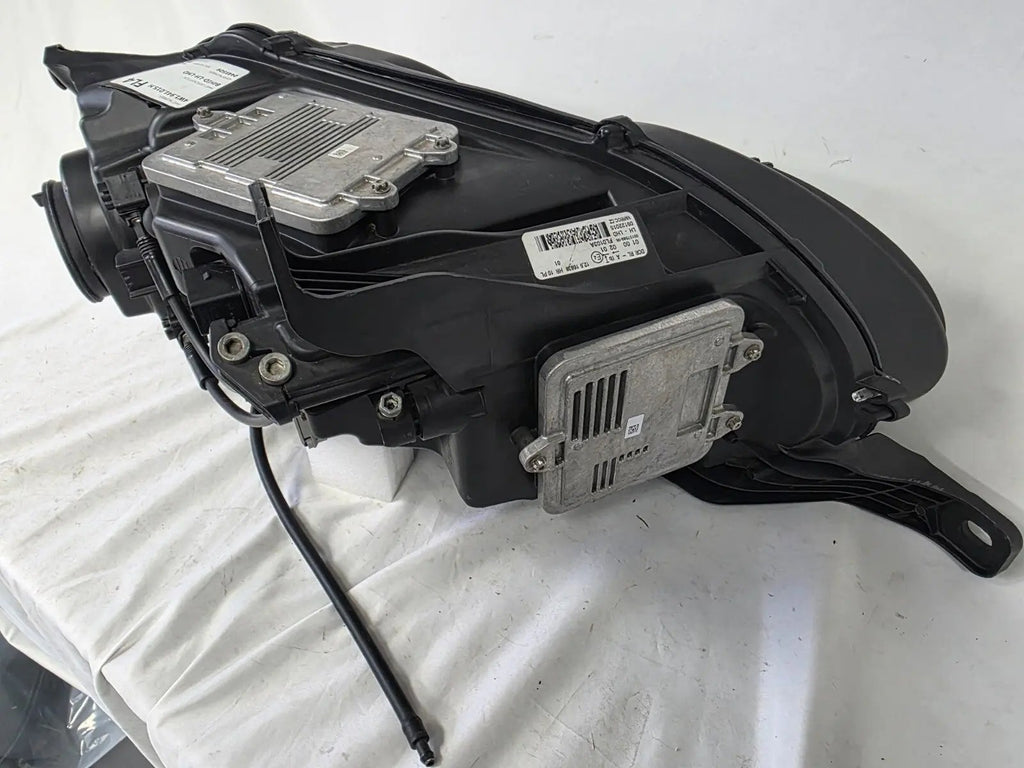 This image shows the left-side headlight for the 2014β2019 Bentley Flying Spur, featuring OEM genuine quality with part number 4W1941015H. This used original headlamp is in excellent condition, offering premium illumination, elegant design, and a precise fit for Bentleyβs high-end luxury sedan