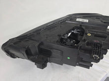 Load image into Gallery viewer, Used genuine BMW Adaptive LED headlight for X1 F48 LCI (facelift) model. This right-side OEM headlamp, part number 5A01178, is equipped with adaptive lighting technology for improved night visibility and cornering performance. The image displays the original right Adaptive LED headlight in used condition, showing the clear lens, mounting brackets, and electrical connectors — an ideal OEM replacement for BMW X1 F48 LCI vehicles.