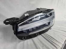 Load image into Gallery viewer, This image features the left-side Xenon headlight for the Volvo XC90, showcasing OEM genuine quality with part number 32404715. This used original headlamp is designed for accurate fitment and delivers powerful Xenon illumination, ensuring optimal visibility, durability, and premium performance for the XC90 luxury SUV
