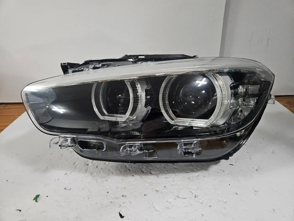 This image features the left-side LED headlight for the BMW 1 Series F20 and F21 LCI (facelift) models, with OEM genuine quality and part number 7492621. This used original headlamp is designed specifically for the facelifted versions, offering sharp LED illumination, precise fitment, and the premium build quality expected from BMW OEM components
