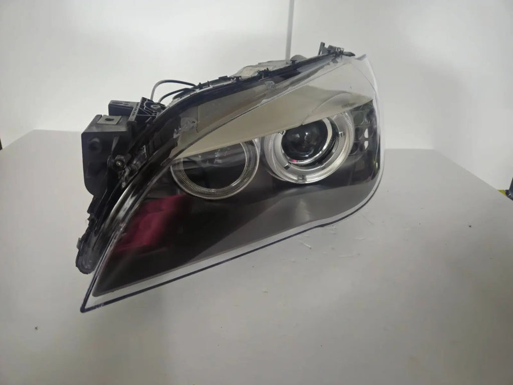 This image features the left-side Xenon headlight for the BMW 7 Series F01/F02 models, showcasing used OEM genuine quality with part number 7225229. Designed specifically for the F01 and F02 chassis, this original headlamp offers high-intensity Xenon lighting and precise fitment for the left side, ensuring reliable performance and compatibility.