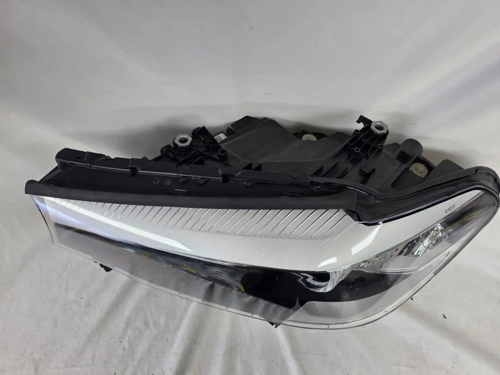 This image shows the left-side LED headlight for the BMW 5 Series G30 and G31 models, featuring OEM genuine quality with part number 7439199. This used original headlamp is engineered for a precise fit on the left side, offering bright and efficient LED illumination, modern styling, and the reliable performance expected from BMW components.