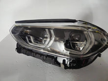 Load image into Gallery viewer, This image shows the left-side ICON Adaptive LED headlight for BMW models iX3 G08, X3 G01, X3 M F97, X4 G02, and X4 M F98, featuring OEM genuine quality with part number 7466119. This used original headlamp is designed to deliver BMW’s signature Adaptive LED lighting with ICON styling, ensuring precise fitment, enhanced visibility, and modern aesthetics for these high-performance models.