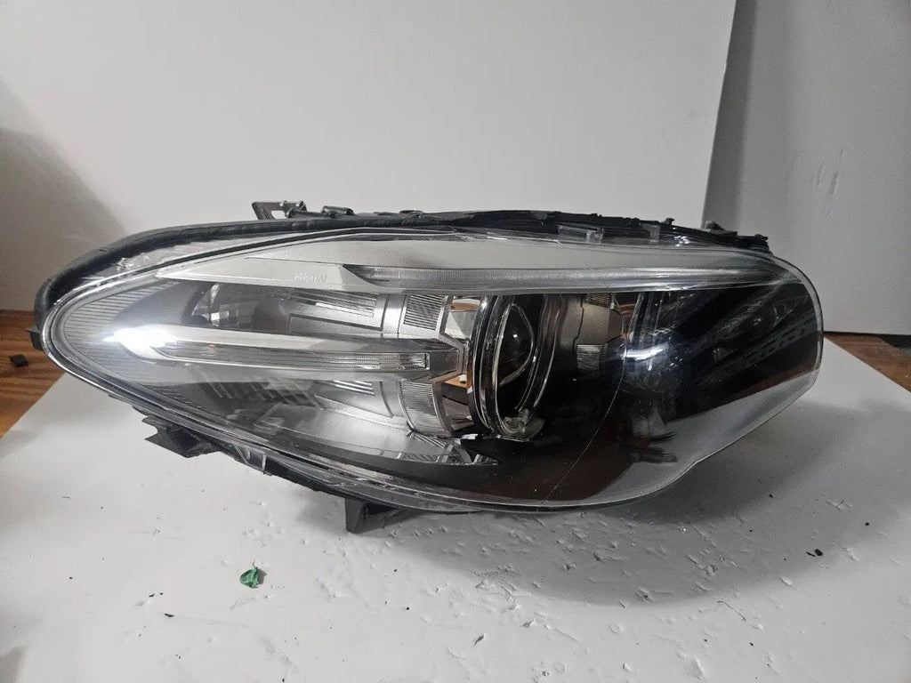 This image displays the right-side Xenon headlight for the BMW 5 Series F18 LCI, F10 LCI, and F11 LCI models, featuring OEM genuine quality with part number 7343912. This used original headlamp is designed specifically for the facelifted (LCI) versions, offering precise fitment, powerful Xenon illumination, and the premium durability expected from authentic BMW components.