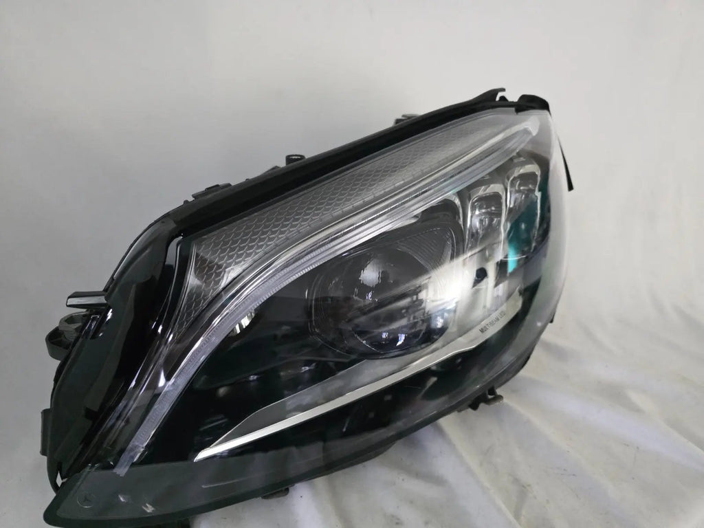 This image features the left-side Multibeam LED headlight for the Mercedes-Benz C-Class W205 Facelift (FL) model, with OEM genuine quality and part number A2059061506. This used original headlamp is designed for a perfect fit on the facelifted W205, delivering advanced Multibeam LED technology for precise, adaptive lighting and optimal driving visibility