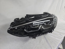 Load image into Gallery viewer, Used genuine BMW LED headlight for 4 Series models including G22, G23, G26, G80, G82, and G83. This left-side OEM headlamp, part number 9851035, is designed to perfectly fit and function in compatible BMW vehicles. The image shows the original BMW LED headlight in used condition with visible connectors, housing, and lens – ideal for replacement or repair of your vehicle’s front lighting system.