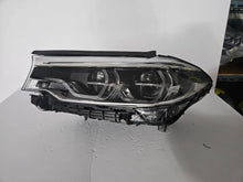 Load image into Gallery viewer, This image shows the left-side Adaptive LED ICON headlight for the BMW 5 Series G30, G31, G38, and F90 LCI models, featuring OEM genuine quality with part number 8499121. This used original headlamp is designed for the facelifted (LCI) versions of these models, offering BMW’s signature Adaptive LED ICON lighting technology for enhanced visibility, precise beam control, and a sleek, modern design.