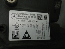 Load image into Gallery viewer, This image features the left-side Multibeam LED headlight for the Mercedes-Benz C-Class W205 Facelift (FL) model, with OEM genuine quality and part number A2059061506. This used original headlamp is designed for a perfect fit on the facelifted W205, delivering advanced Multibeam LED technology for precise, adaptive lighting and optimal driving visibility