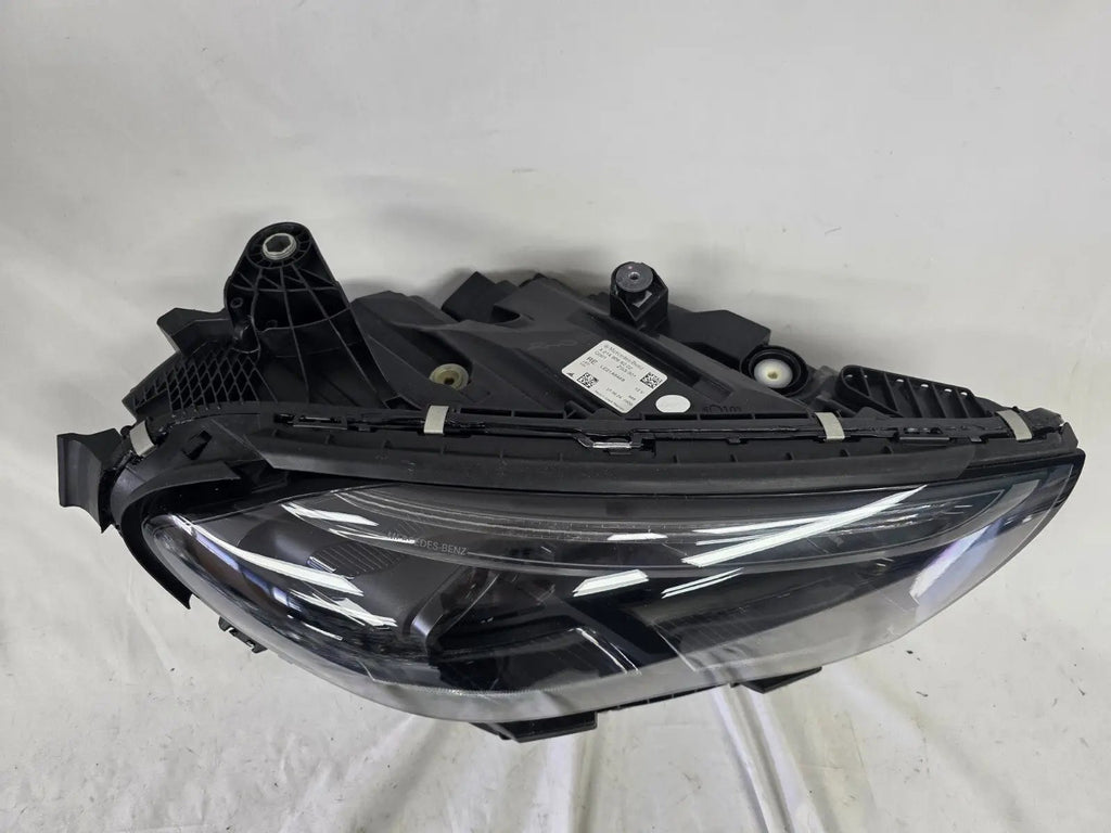 This image showcases the OEM genuine DIGITAL LIGHT headlights for the Mercedes-Benz E-Class W214, available for both right and left sides with part numbers A2149066102 (right) and A2149066202 (left). These advanced headlamps are original Mercedes-Benz components designed for the W214 model, offering cutting-edge DIGITAL LIGHT technology that enhances driving safety and precision lighting. The headlights are used but maintain high-quality OEM standards and are ideal replacements for the corresponding side.