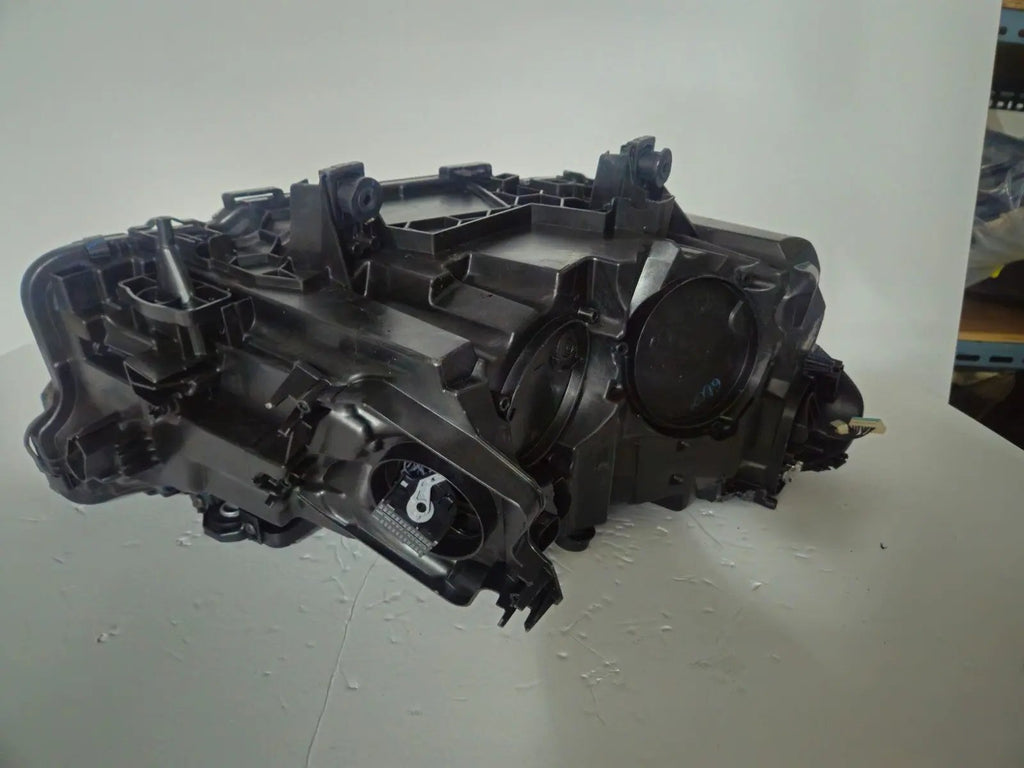 This image features the left-side Adaptive LED headlight for BMW models including iX3 G08, X3 G01, X3 M F97, X4 G02, and X4 M F98, with OEM genuine quality and part number 5A29203. This used original headlamp provides precise fitment and BMW’s advanced Adaptive LED technology, ensuring enhanced visibility, dynamic beam control, and premium styling for these performance SUVs.