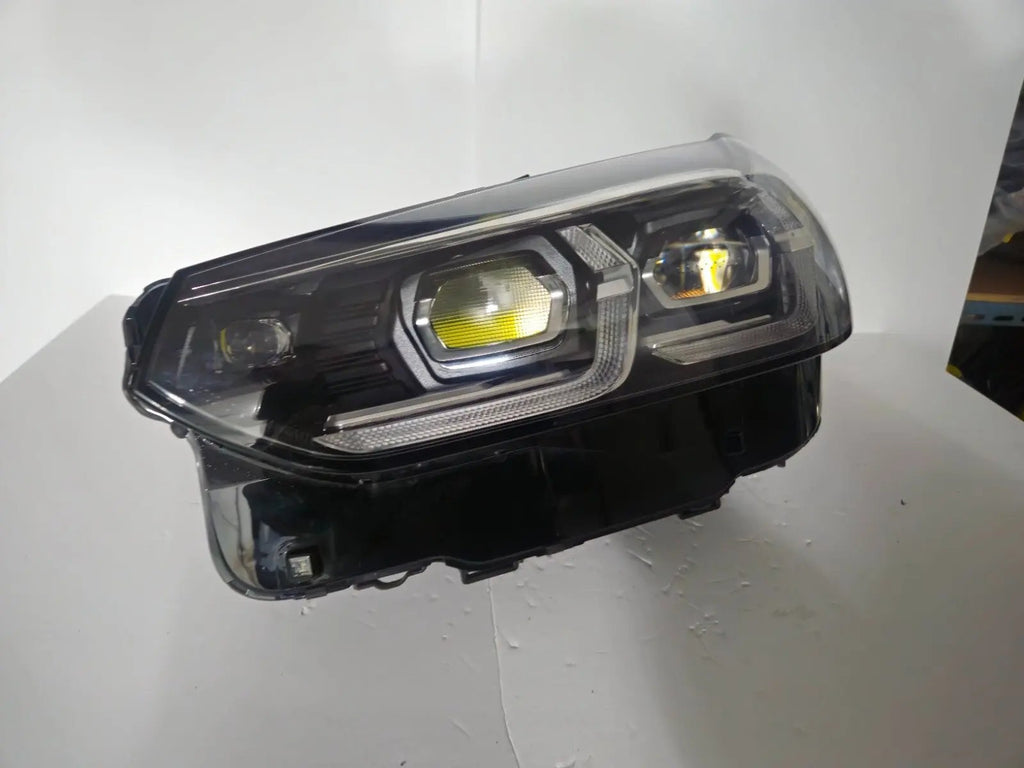 This image features the left-side Adaptive LED headlight for BMW models including iX3 G08, X3 G01, X3 M F97, X4 G02, and X4 M F98, with OEM genuine quality and part number 5A29203. This used original headlamp provides precise fitment and BMW’s advanced Adaptive LED technology, ensuring enhanced visibility, dynamic beam control, and premium styling for these performance SUVs.