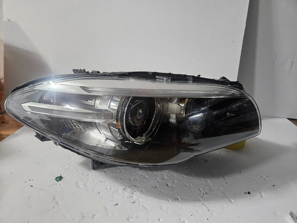 This image displays the right-side Xenon headlight for the BMW 5 Series F18 LCI, F10 LCI, and F11 LCI models, featuring OEM genuine quality with part number 7343912. This used original headlamp is designed specifically for the facelifted (LCI) versions, offering precise fitment, powerful Xenon illumination, and the premium durability expected from authentic BMW components.