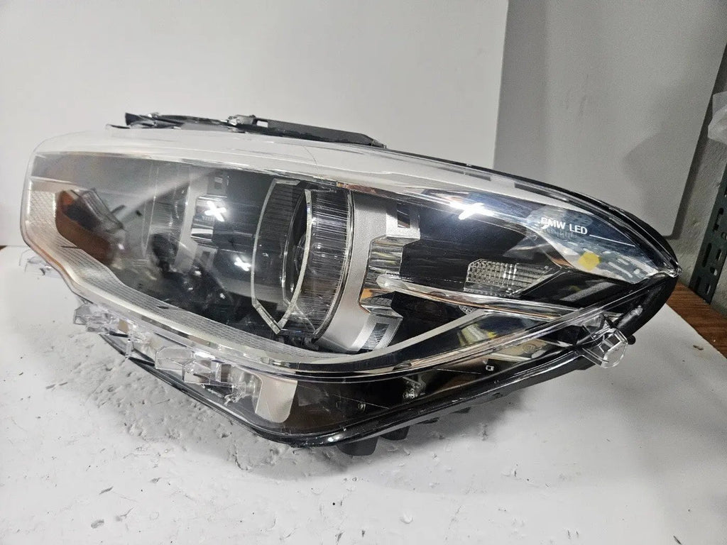 This image shows the left-side LED headlight for the BMW 1 Series F20 and F21 LCI (facelift) models, featuring OEM genuine quality with part number 7453517. This used original headlamp is engineered for a precise fit, delivering bright and efficient LED illumination along with the premium styling and performance expected from BMW's facelifted 1 Series.