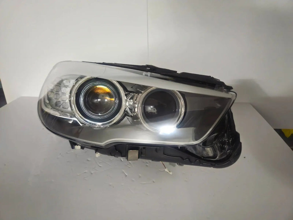 This image shows the right-side Bi-Xenon headlight for the BMW 5 Series GT F07 model, featuring OEM genuine quality with part number 7262720. It is a used original headlight designed for precise fit on the right side of the BMW F07 Gran Turismo, offering advanced Bi-Xenon lighting performance and durable OEM construction