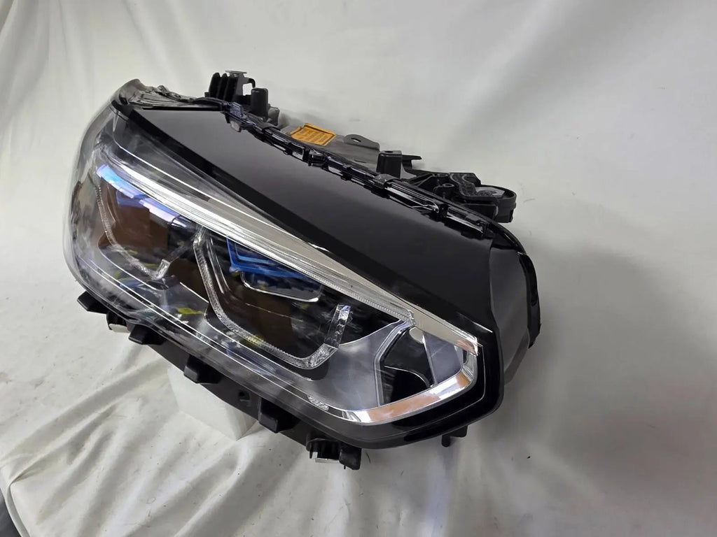 This image displays the right-side Laser headlight for BMW models X5 G05, X5 M F95, X6 G06, and X6 M F96, featuring OEM genuine quality with part number 9481790. This used original headlamp is designed for a precise factory fit and delivers advanced BMW Laserlight technology, ensuring superior illumination, modern styling, and high-performance visibility for these premium SUV models.