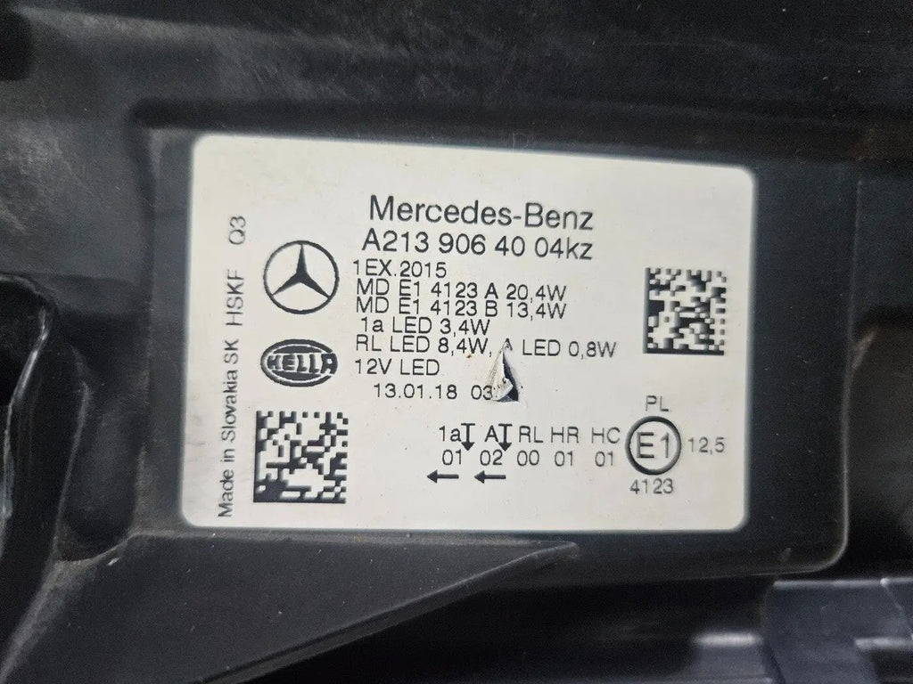 This image features the right-side LED High Performance headlight for the Mercedes-Benz E-Class W213, showcasing OEM genuine quality with part number A2139064004. Specifically designed for the W213 model, this used headlight offers high-performance LED illumination and is an original Mercedes-Benz component, ensuring precise fit and reliable functionality