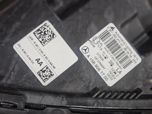 Load image into Gallery viewer, Genuine used Mercedes-Benz Bi-Xenon headlight for GLA-Class model X156. This left-side (LH) OEM headlamp, part number A1569061700, features Bi-Xenon lighting technology for enhanced night visibility and a focused beam pattern. The image shows the original left headlight in used condition, highlighting the lens clarity, projector unit, mounting brackets, and electrical connector — ideal for replacing a damaged headlamp on compatible Mercedes-Benz GLA X156 vehicles.