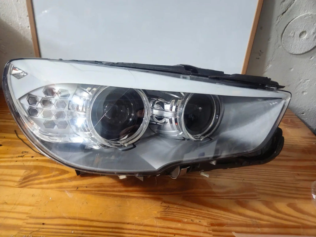 This image shows the right-side Bi-Xenon headlight for the BMW 5 Series GT F07 model, featuring OEM genuine quality with part number 7262720. It is a used original headlight designed for precise fit on the right side of the BMW F07 Gran Turismo, offering advanced Bi-Xenon lighting performance and durable OEM construction