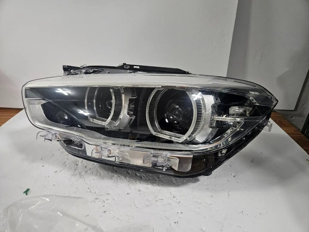 This image shows the left-side LED headlight for the BMW 1 Series F20 and F21 LCI (facelift) models, featuring OEM genuine quality with part number 7453517. This used original headlamp is engineered for a precise fit, delivering bright and efficient LED illumination along with the premium styling and performance expected from BMW's facelifted 1 Series.
