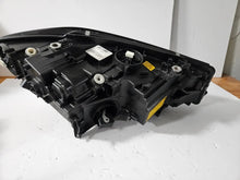 Load image into Gallery viewer, Genuine used BMW Laser headlight for 3 Series models G20 and G21. This left-side OEM headlamp, part number 9481707, features high-performance laser lighting technology for superior road visibility and driving precision. The image showcases the original left laser headlight in used condition, clearly showing the lens structure, housing, and connector ports β ideal for replacing a damaged headlamp on compatible BMW 3 Series vehicles.