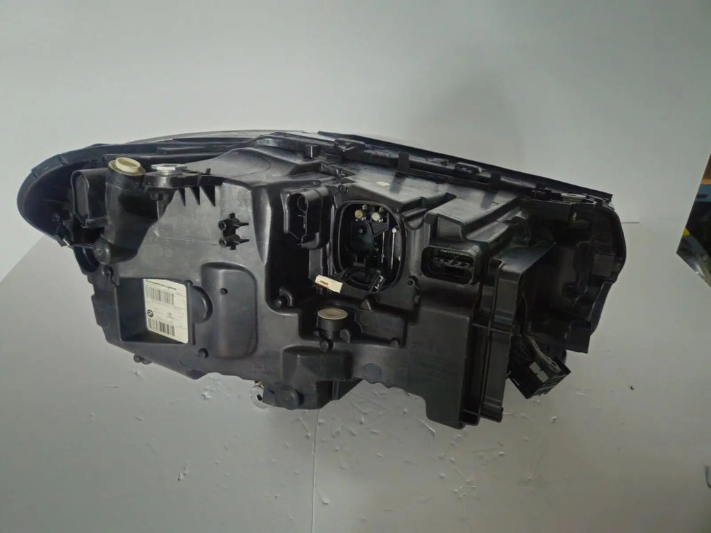This image shows the left-side ICON Adaptive LED headlight for BMW models iX3 G08, X3 G01, X3 M F97, X4 G02, and X4 M F98, featuring OEM genuine quality with part number 7466119. This used original headlamp is designed to deliver BMW’s signature Adaptive LED lighting with ICON styling, ensuring precise fitment, enhanced visibility, and modern aesthetics for these high-performance models.