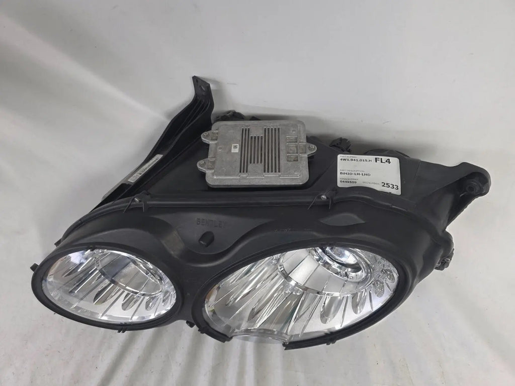 This image shows the left-side headlight for the 2014β2019 Bentley Flying Spur, featuring OEM genuine quality with part number 4W1941015H. This used original headlamp is in excellent condition, offering premium illumination, elegant design, and a precise fit for Bentleyβs high-end luxury sedan