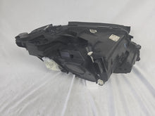 Load image into Gallery viewer, This image displays the left-side Multibeam LED headlight with blue accents for the Mercedes-Benz E-Class W213, featuring OEM genuine quality and part number A2139066504. This original used headlamp is designed for precise fitment on the W213 model, offering advanced Multibeam LED technology with distinctive blue detailing for high-performance adaptive illumination and premium styling