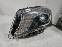 Load image into Gallery viewer, This image shows the left-side Xenon headlight for the Mercedes-Benz CLA Class C117, featuring original OEM quality with part number A1179065100. The headlight is a used but genuine component, designed to perfectly fit the left side of the CLA C117 model. It includes the factory-built Xenon lighting system and showcases the durable construction expected from Mercedes-Benz parts.