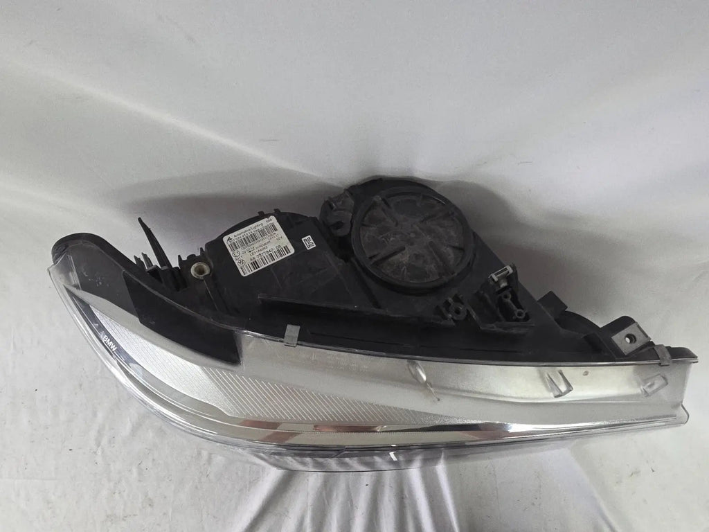 Genuine used BMW Adaptive LED headlight for 4 Series models F32, F33, F36, F80 LCI, F82, and F83. This right-side OEM headlamp, part number 7377842, is designed with adaptive lighting technology for improved visibility and performance. The image highlights the complete original headlight unit in used condition, including the clear lens, mounting points, and electrical connectors — ideal for replacement on compatible BMW models.