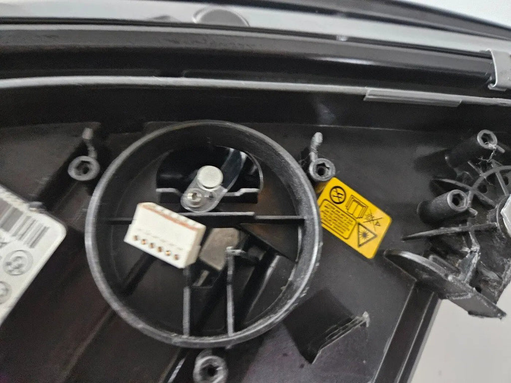 Genuine used BMW Laser headlight for 3 Series models G20 and G21. This left-side OEM headlamp, part number 9481707, features high-performance laser lighting technology for superior road visibility and driving precision. The image showcases the original left laser headlight in used condition, clearly showing the lens structure, housing, and connector ports β ideal for replacing a damaged headlamp on compatible BMW 3 Series vehicles.