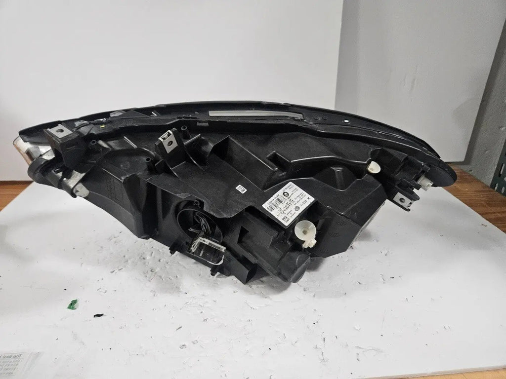 This image displays the right-side LED headlight for the BMW 1 Series F20 and F21 LCI (facelift) models, featuring OEM genuine quality with part number 7414142. This used original headlamp is engineered for a precise fit on the facelifted 1 Series, offering bright LED illumination, modern styling, and reliable performance from an authentic BMW component