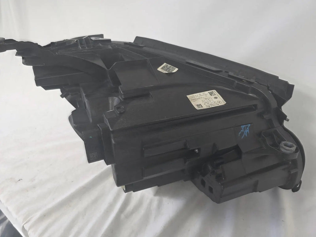 This image displays the left-side Multibeam LED headlight with blue accents for the Mercedes-Benz E-Class W213, featuring OEM genuine quality and part number A2139066504. This original used headlamp is designed for precise fitment on the W213 model, offering advanced Multibeam LED technology with distinctive blue detailing for high-performance adaptive illumination and premium styling