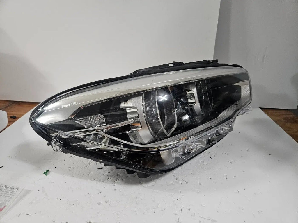 This image displays the right-side LED headlight for the BMW 1 Series F20 and F21 LCI (facelift) models, featuring OEM genuine quality with part number 7453518. This used original headlamp is designed for perfect fitment on facelifted versions, delivering bright LED illumination, modern styling, and dependable performance true to BMW standards