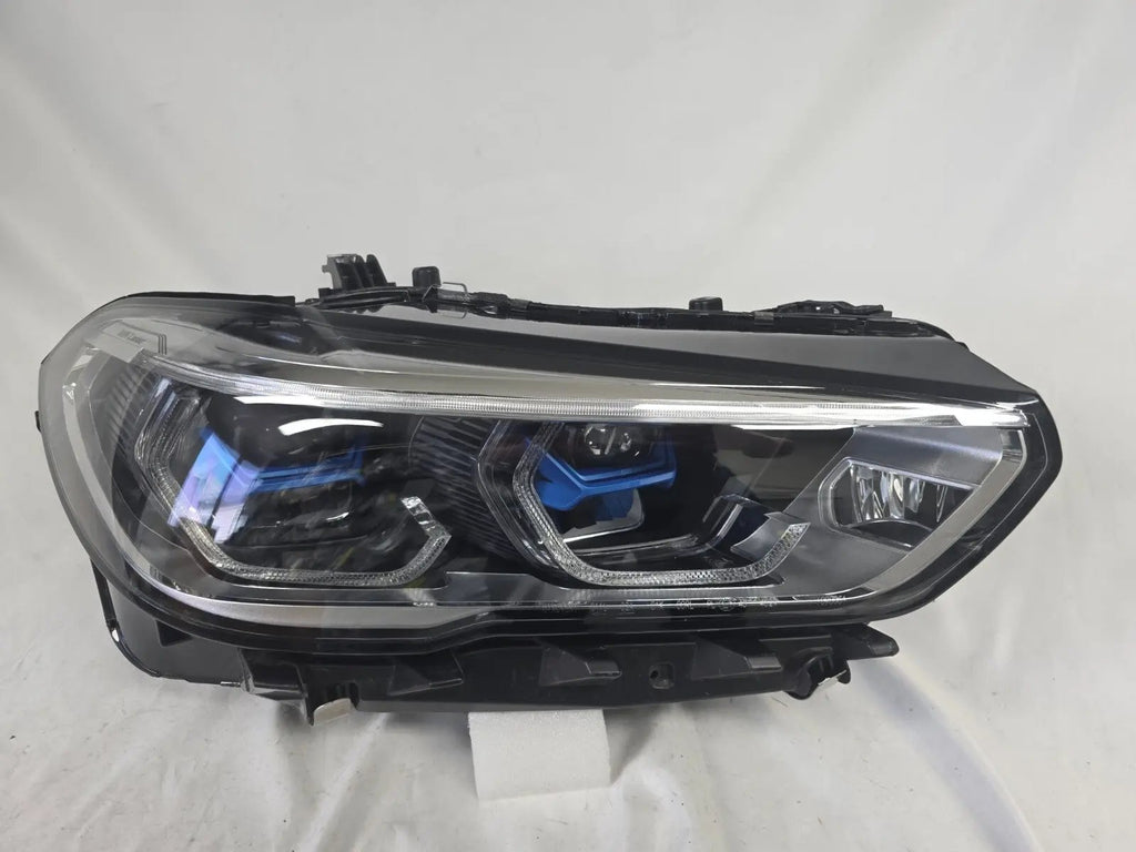 This image displays the right-side Laser headlight for BMW models X5 G05, X5 M F95, X6 G06, and X6 M F96, featuring OEM genuine quality with part number 9481790. This used original headlamp is designed for a precise factory fit and delivers advanced BMW Laserlight technology, ensuring superior illumination, modern styling, and high-performance visibility for these premium SUV models.