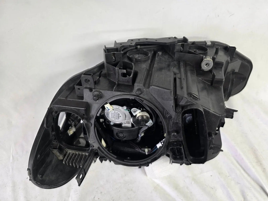 Genuine used BMW Adaptive LED headlight for 4 Series models F32, F33, F36, F80 LCI, F82, and F83. This right-side OEM headlamp, part number 7377842, is designed with adaptive lighting technology for improved visibility and performance. The image highlights the complete original headlight unit in used condition, including the clear lens, mounting points, and electrical connectors — ideal for replacement on compatible BMW models.